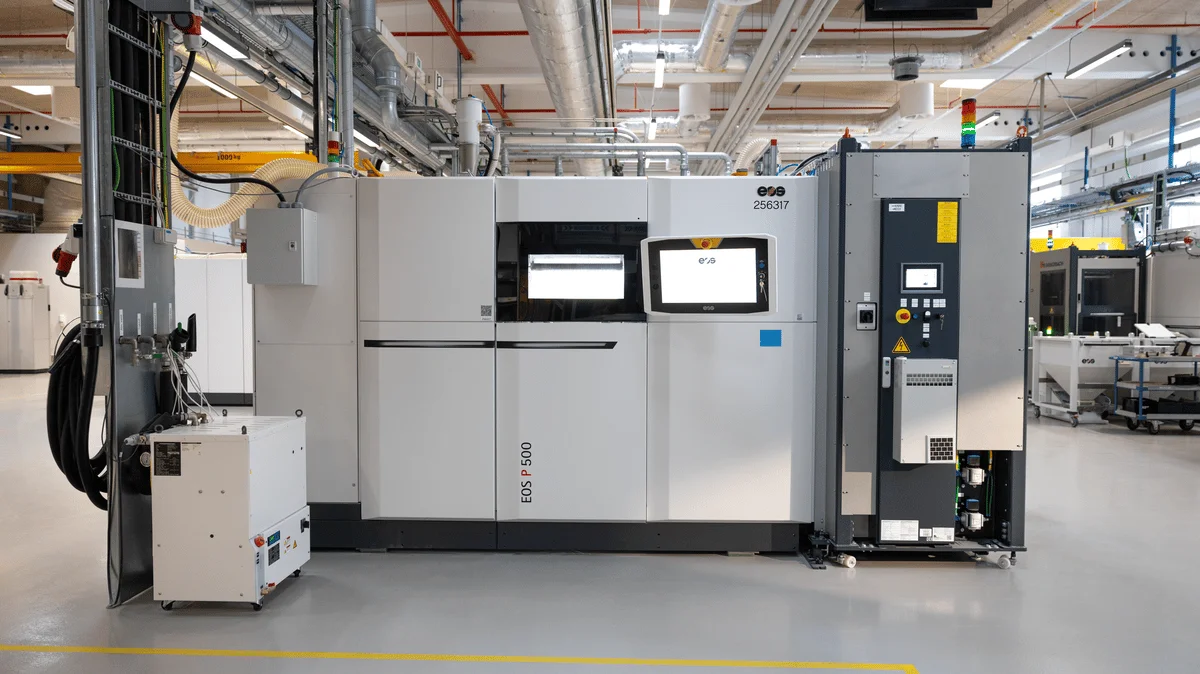 Industrial 3D printing system on a factory floor, illustrating the kind of additive manufacturing capacity behind mass-produced 3D printed toys