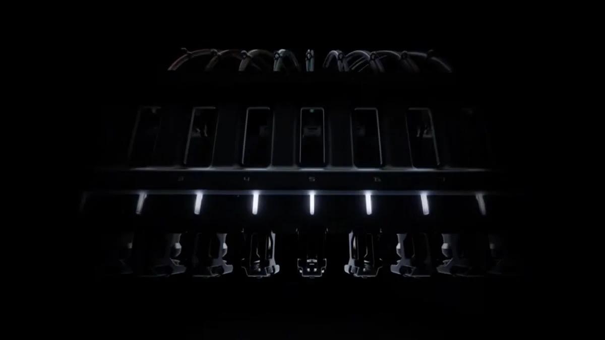 Bambu Lab H3C tool changer teaser showing nine numbered tool docks with filament tubes